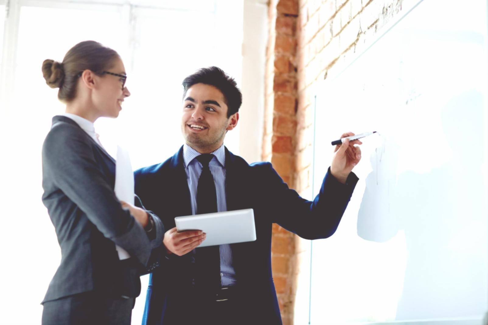 Business meeting discussing financial scenarios